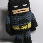 The Caped Crusader, but small and made of yarn.