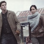 Katniss, sporting a stylish scarf/cowl.