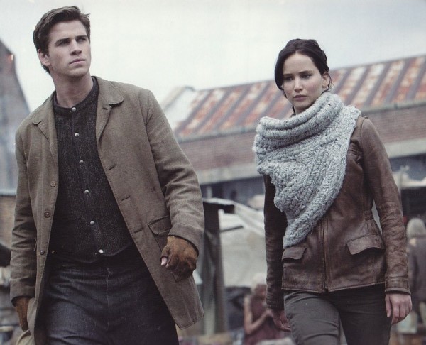 Katniss, sporting a stylish scarf/cowl.